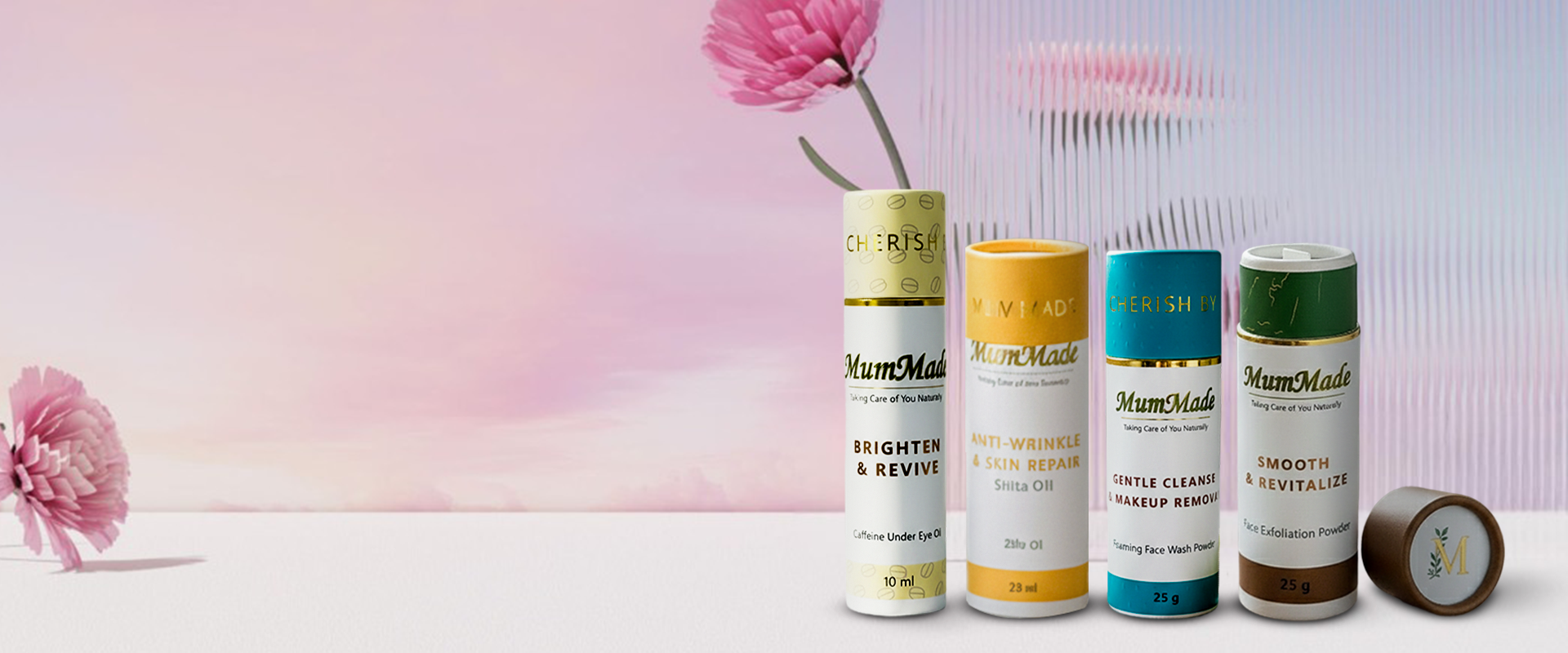 Four skincare product tubes labeled 'MumMade' on a light purple background with flowers.1621243260e1af0c20-0